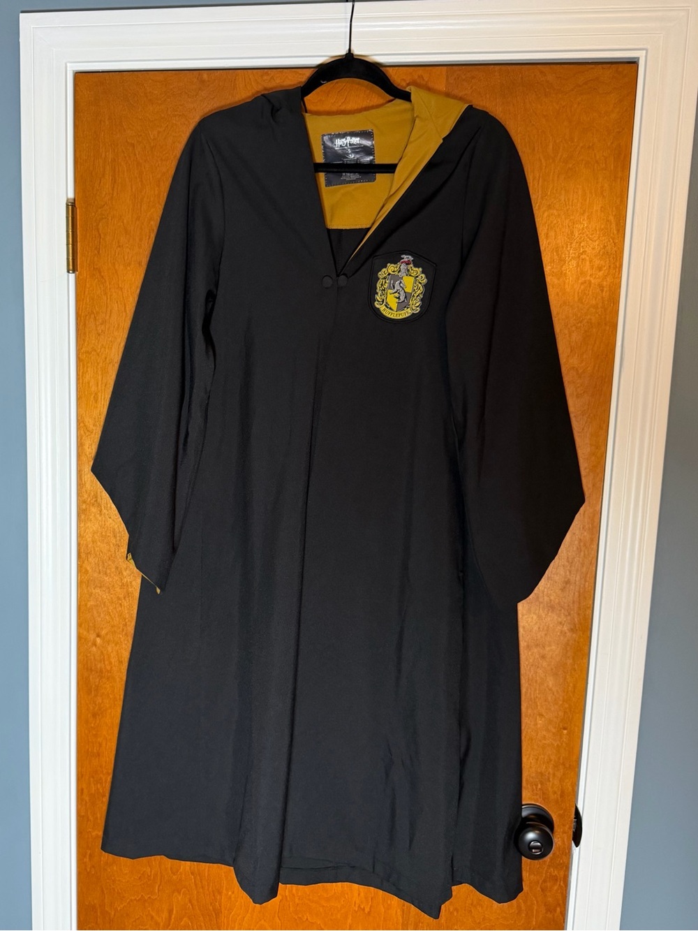 Harry Potter Kids' Black Hooded Robe with Hufflepuff logo. Size Small.